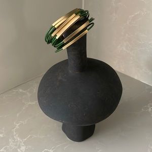 Hagar Satat leather Bracelet with gold tubes.